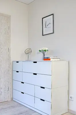 a white dresser with a mirror on top of it at Business-class apartments 1 x Free parking x SELF CHECK IN 24x7 in Vilnius