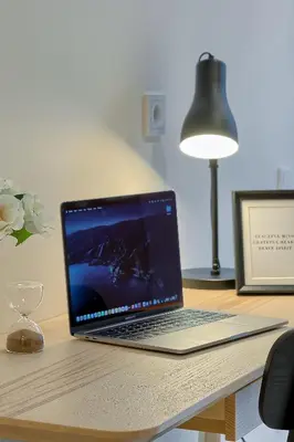 a laptop computer sitting on top of a desk at Business-class apartments 1 x Free parking x SELF CHECK IN 24x7 in Vilnius