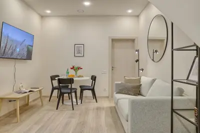 a living room with a couch and a table at Business-class apartments 1 x Free parking x SELF CHECK IN 24x7 in Vilnius