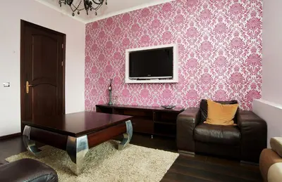 a living room with a couch and a table and a tv at Cathedral Apartment FREE Parking in Vilnius