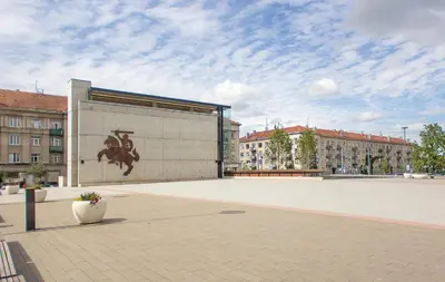 a building with a painting of a horse on it at Butas Šiaulių mieste in Šiauliai