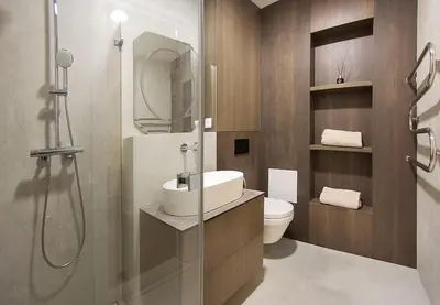 a bathroom with a sink and a shower and a toilet at Butas Šiaulių mieste in Šiauliai