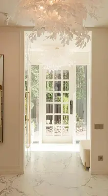 a living room with a large window and a chandelier at 252 m² luxury 4 bedroom house in the pine-forest in Vilnius