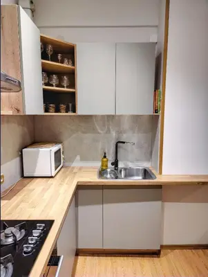 a kitchen with a sink and a microwave at Spacious apartment near old town in Vilnius