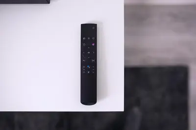 a remote control sitting on top of a white wall at Laurentroom Hotel in Ukmergė