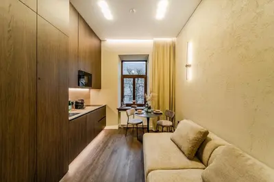 a living room with a couch and a table at Central Park Apartments - The Luxury Collection in Kaunas