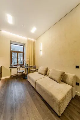 a living room with a couch and a table at Central Park Apartments - The Luxury Collection in Kaunas