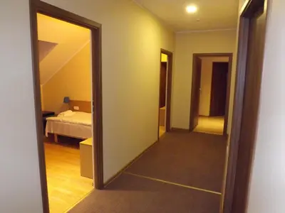 a room with a door leading to a bedroom at Kaimo turizmas 