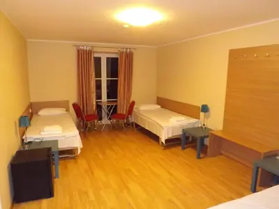 a hospital room with two beds and a window at Kaimo turizmas 