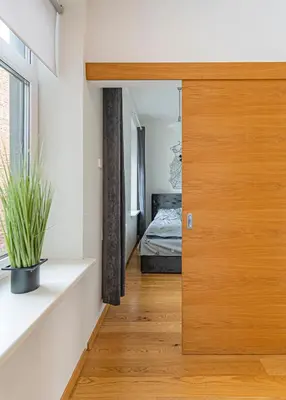 a room with a door leading to a bedroom at CityVibe apartment by Polo Apartments in Kaunas