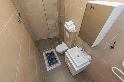 an overhead view of a bathroom with a toilet and a sink at CityVibe apartment by Polo Apartments in Kaunas