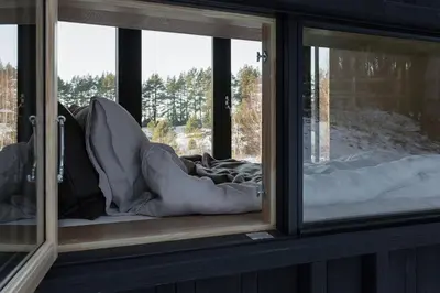 a room with two windows with pillows and blankets at Konga Stay L in Aluona