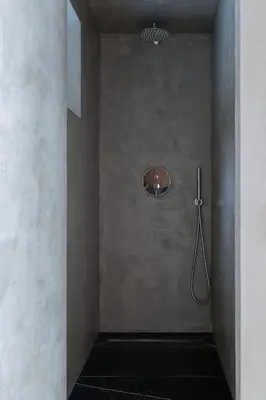 a bathroom with a shower in a wall at Konga Stay L in Aluona