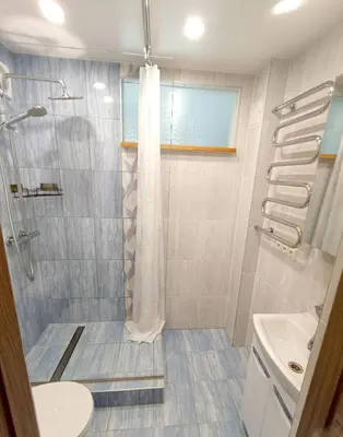 a bathroom with a shower and a sink at Vytekstos Apartamentai in Druskininkai