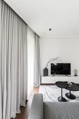 a living room with a couch and a table at Spacious luxury apt w/river view/terrace Paupys in Vilnius