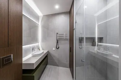 a bathroom with a glass shower and a sink at Spacious luxury apt w/river view/terrace Paupys in Vilnius