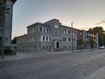 a building on the side of a street at Old street apartment in Šiauliai
