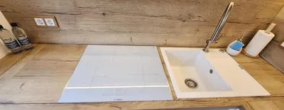 a bathroom counter with a sink in a room at Golden in Šiauliai