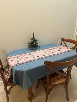 a table with a christmas tree on top of it at Spectacular river view apartment in Vilnius