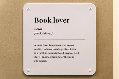 a book lover sign on a wall at Art&Comfort Country in Kaunas