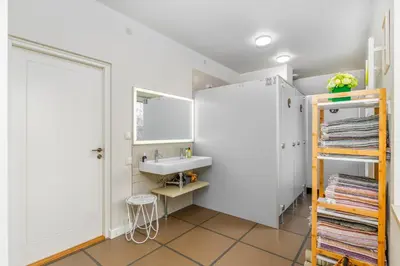 a bathroom with a sink and a mirror at Art&Comfort Country in Kaunas