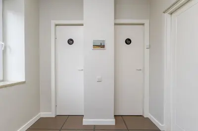 two doors in a room with white walls at Art&Comfort Country in Kaunas