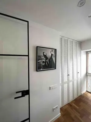 a white room with a picture on the wall at New appartment with art collection in Vilnius