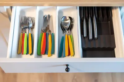 a drawer full of utensils with colorful utensils at #stayhere - Brand New Colourful Studio close to Shopping Malls in Vilnius