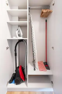 a room with a vacuum cleaner on the shelves at #stayhere - Brand New Colourful Studio close to Shopping Malls in Vilnius