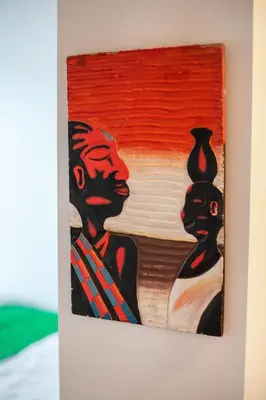 a painting of two men on a wall at #stayhere - Brand New Colourful Studio close to Shopping Malls in Vilnius