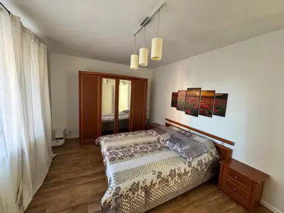 a bedroom with a bed and a window at Holiday Ap in Visaginas
