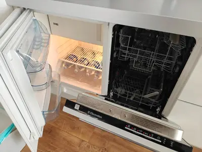 an empty refrigerator with its door open and its contents at Holiday Ap in Visaginas