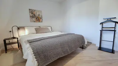 a bedroom with a bed and a glass shelf at G-47 Near the Parliament - Self check in in Vilnius