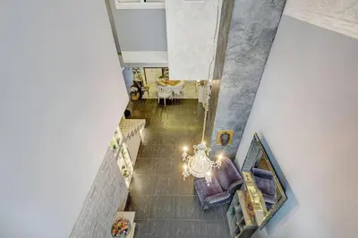 an overhead view of a living room with a chandelier at LOCUSDO Apartment no. 137 near OZAS, AKROPOLIS in Vilnius