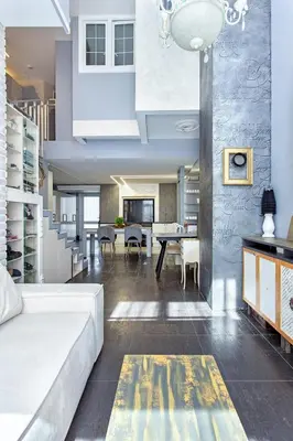 a living room with a couch and a dining room at LOCUSDO Apartment no. 137 near OZAS, AKROPOLIS in Vilnius