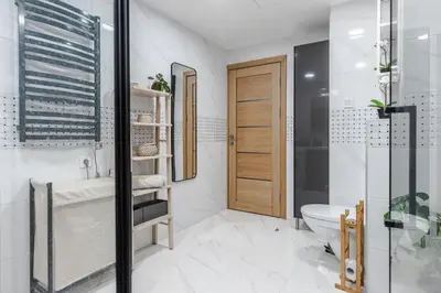 a bathroom with a shower and a toilet and a sink at Fantasy House, cozzy apartmens, free parking, long stays welcome in Vilnius