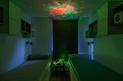 a room with two beds and a star ceiling at Fantasy House, cozzy apartmens, free parking, long stays welcome in Vilnius