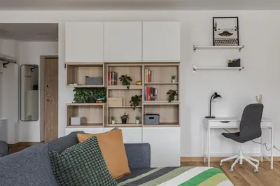a living room with a couch and a desk at Fantasy House, cozzy apartmens, free parking, long stays welcome in Vilnius