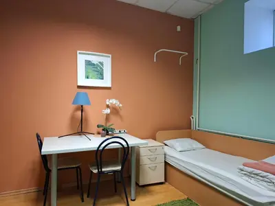 a bedroom with a desk and a bed and a desk and chair at Jamaika @ Shopen in Vilnius