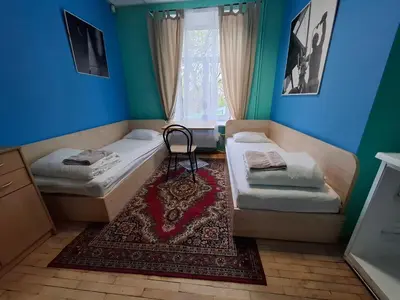 a room with two beds and a window at Jamaika @ Shopen in Vilnius