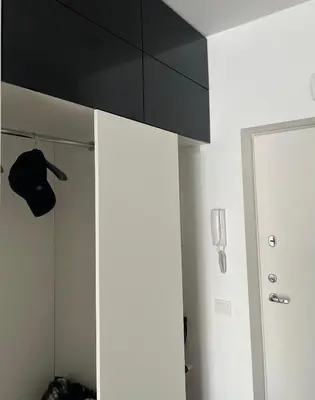 a room with a white cabinet with a black ceiling at Apartment near Vilnius Outlet in Vilnius