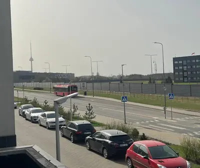 a group of cars parked in a parking lot at Apartment near Vilnius Outlet in Vilnius