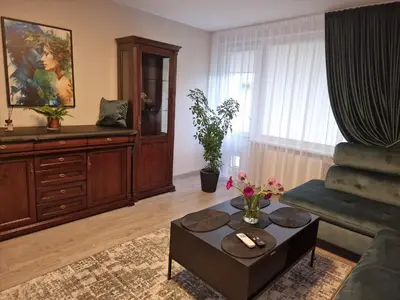 a living room with a couch and a coffee table at Butas in Kaunas