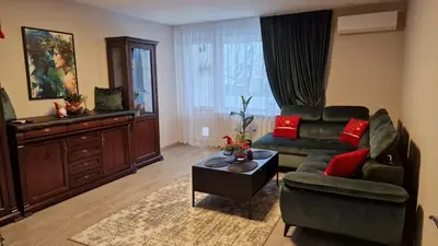 a living room with a couch and a table at Butas in Kaunas