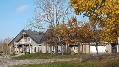 a large house with a gambrel at Villa Cheval in Aukštadvaris