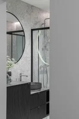 a bathroom with a sink and a mirror at No. 1 PARK AVENUE APARTMENT in Kaunas