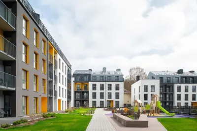 a group of buildings with a playground in the middle at No. 1 PARK AVENUE APARTMENT in Kaunas