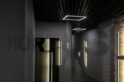 a dark hallway with a hallway at Hortus Vilnius in Vilnius