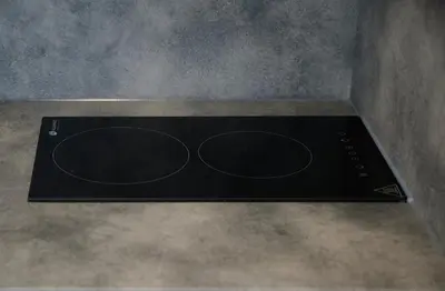 a black stove top oven in a room at Studio COZY VISIT, balcony, 24h self check-in, first floor, great location in Kaunas