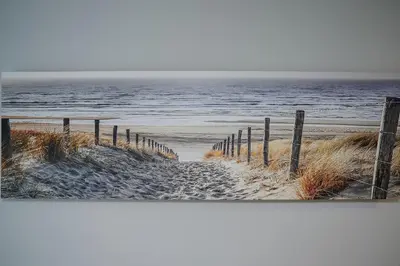 a picture of a beach with the ocean and a fence at Studio COZY VISIT, balcony, 24h self check-in, first floor, great location in Kaunas
